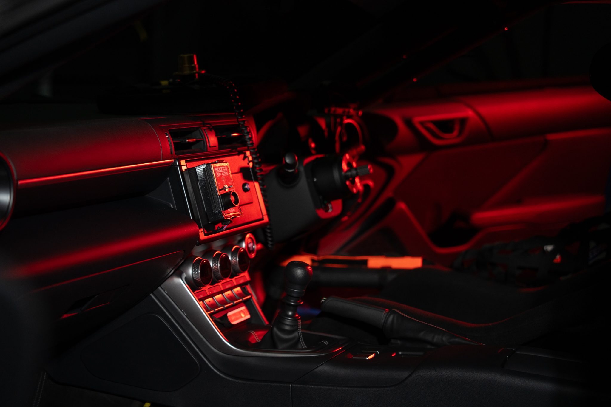 Red light across the Redline GR86 cockpit